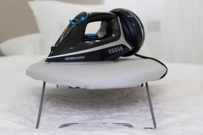 a virtual reality helmet sitting on top of a chair at Dar élégant au centre de Marrakech piscine in Marrakech