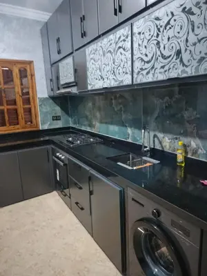 a kitchen with a sink and a washing machine at house mohamed in Marrakech
