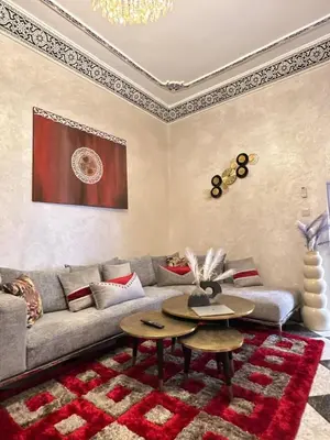 a living room with a couch and a table at flat in Marrakech in Marrakech
