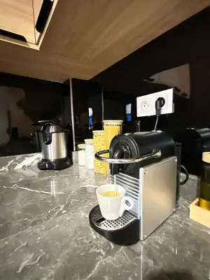 a coffee maker is making a cup of coffee at flat in Marrakech in Marrakech