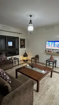 a living room with a couch and a coffee table at Secure luxury apartment in Marrakech