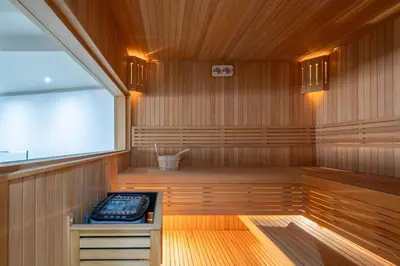 a sauna with a bench in the middle of it at Gueliz apartment with pool, spa and gym in Marrakech
