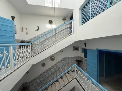 a staircase in a house with blue and white stairs at Calm & Authentic in Marrakesh in Marrakech