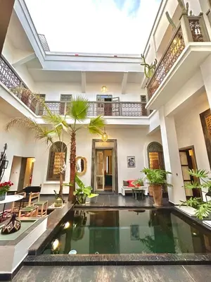 a villa with a swimming pool in a house at Riad 191 - Maison privée, spa & piscine in Marrakech