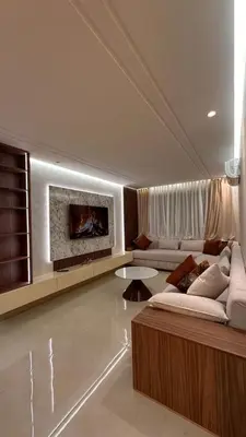 a living room with a couch and a fireplace at Appartement luxueux au centre in Marrakech