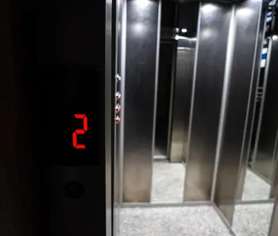 an elevator door with the number three on it at Oasis Urban avec Balcon - 5min de l'aéroport in Marrakech