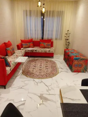 a living room with two couches and a marble floor at Elegant 2 bedroom apartment in Palmeraie Gates in Marrakech