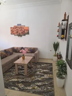 a living room with a couch and a coffee table at appartement lady Plaza 2 in Marrakech