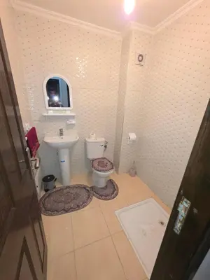 a bathroom with a toilet and a sink at appartement lady Plaza 2 in Marrakech