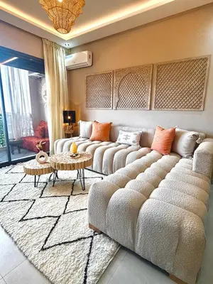 a living room with a large couch and a table at Majorelle Luxury Studio in Marrakech
