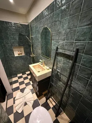 a bathroom with a sink and a mirror at Riad Dar Siyah in Marrakech