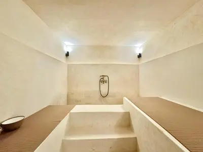 a bathroom with a bath tub and a sink at Maison Remedy et Spa Private Pool & Breakfast in Marrakech