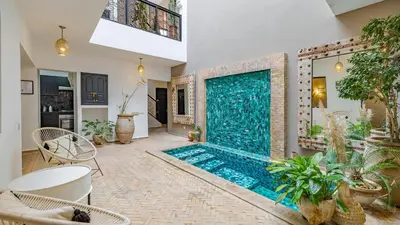a swimming pool in the middle of a living room at Riad Awajana Marrakech - Piscine - Jacuzzi in Marrakech