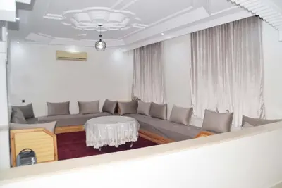 a living room with a couch and a table at Villa Familiale in Marrakech