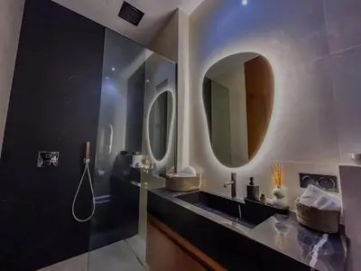 a bathroom with a sink and a mirror at MIKESTAY - Villa Sherazade in Marrakech