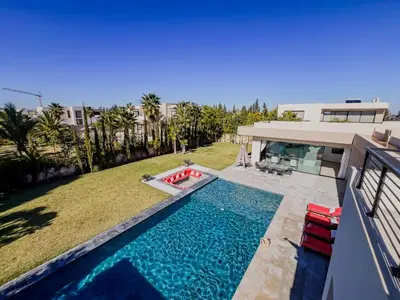 a swimming pool in the backyard of a house at MIKESTAY - Villa Sherazade in Marrakech