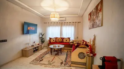 a living room with a couch and a table at le 26M in Marrakech