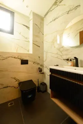 a bathroom with a sink and a toilet at Exceptional Apartment Overlooking Marrakech Train Station in Marrakech