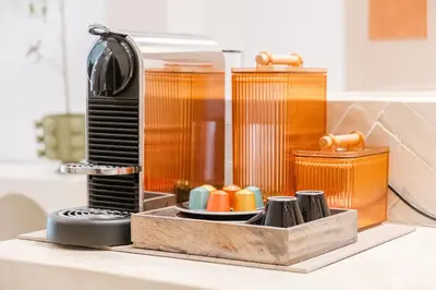 a kitchen counter with a coffee maker on a table at 3BR Gueliz , Rooftop Heated Pool , 10 min Jamaa el Fna, in Marrakech