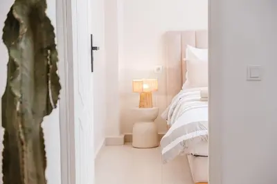 a bedroom with a bed and a lamp on a floor at 3BR Gueliz , Rooftop Heated Pool , 10 min Jamaa el Fna, in Marrakech