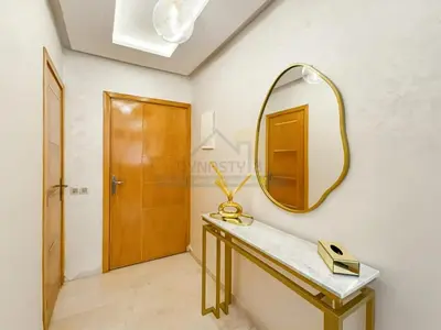 a dressing room with a mirror and a dressing table at Appartement de charme au cœur de la ville rouge in Marrakech