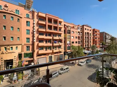 a view of a parking lot in front of a building at Appartement de charme au cœur de la ville rouge in Marrakech