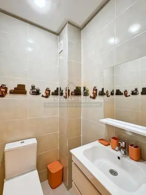 a bathroom with a toilet and a sink at Appartement de charme au cœur de la ville rouge in Marrakech