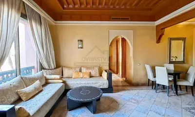 a living room with a couch and a table at Evasion élégante à la Palmeraie in Marrakech