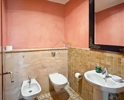 a bathroom with a toilet and a sink at Evasion élégante à la Palmeraie in Marrakech
