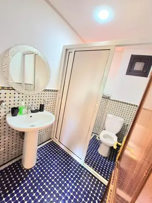 a bathroom with a sink and a toilet at Appartement centre ville Gueliz in Marrakech