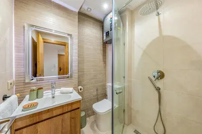 a bathroom with a shower and a sink and a toilet at Studio élégant et paisible au cœur de Marrakech in Marrakech