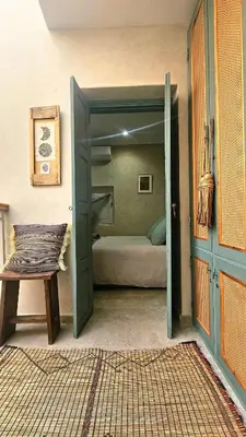 an open door to a bedroom with a bed at Douiria des Loulous in Marrakech