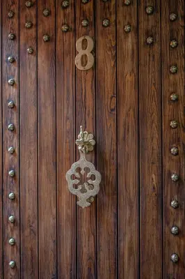 a wooden wall with a door with a snowflake on it at Riad Garden View in Marrakech