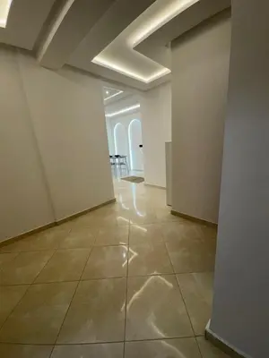 an empty room with white walls and a tile floor at Appartement 2 Chambres 2 Balcons Gueliz in Marrakech