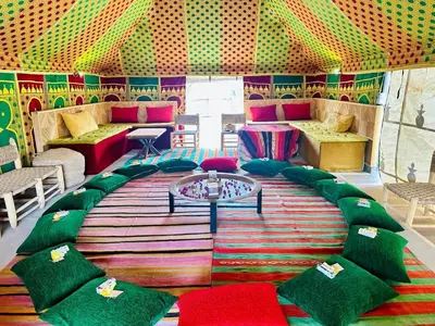 a room with a colorful room with a table and chairs at Villa Romana in Marrakech