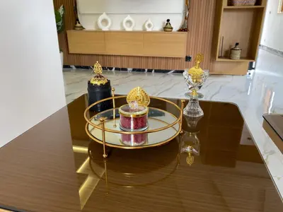 a glass table with two candles on top of it at Appartement neuf et équipé, proche de commodités in Marrakech