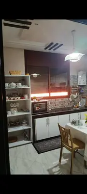 a kitchen with a table and a dining room at Afaq1,saada in Marrakech