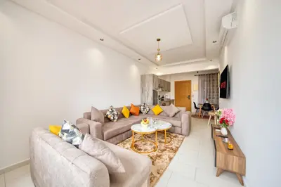 a living room with two couches and a table at The best JINANE in Marrakech