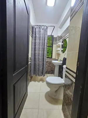 a bathroom with a toilet and a sink at Chya home in Marrakech