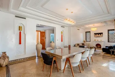 a dining room with a table and chairs at Andalusian Dream Villa pool and balcony in Marrakech