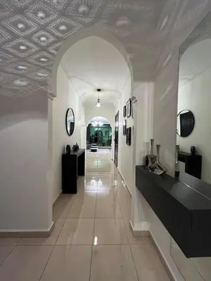a hallway with white walls and a ceiling at Amjad in Marrakech