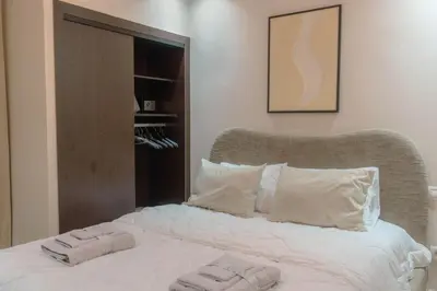 a bed with two towels on top of it at Hotel-Style Studio - High speed internet - Parking in Marrakech