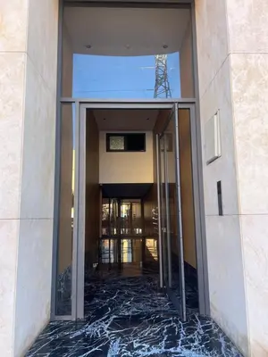 an entrance to a building with a glass door at Appartement cosy près de Gueliz in Marrakech