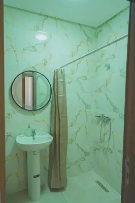 a bathroom with a sink and a mirror at Spacious Apartment with AC & Fast WiFi 5 Guests in Marrakech