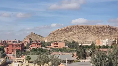 a view of a city with a mountain in the background at Appartement Laila Guéliz - Victor Hugo in Marrakech