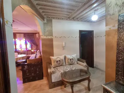 a living room with a couch and a table at Appartement Laila Guéliz - Victor Hugo in Marrakech
