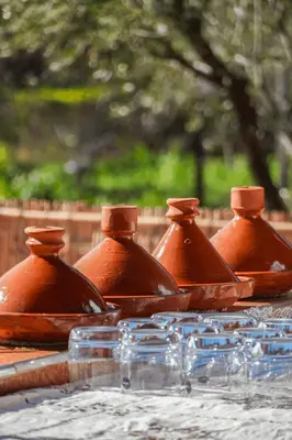 a group of copper dishes sitting on a table at Chamali House Peaceful Nature Farm Stay Ferme Zarraba in El Rhechat