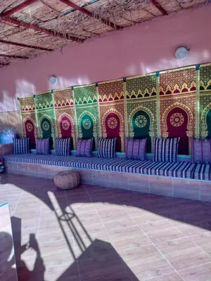a room with a row of blue and purple chairs at Chamali House Peaceful Nature Farm Stay Ferme Zarraba in El Rhechat
