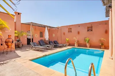 a pool in the backyard of a house at Villa MyMa in Marrakech