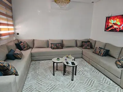 a living room with a couch and a table at مراكش in Marrakech